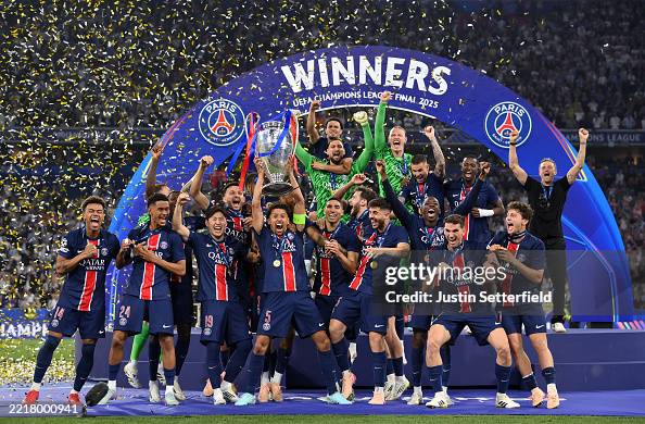 MUNICH, GERMANY - MAY 31:  Marquinhos of Paris Saint-Germain lifts the UEFA Champions League trophy after his team's victory, to secure Paris Saint-Germain's first ever UEFA Champions League title in the club's history and a record UEFA Champions League Final winning scoreline of 5-0, following the UEFA Champions League Final 2025 between Paris Saint-Germain and FC Internazionale Milano at Munich Football Arena on May 31, 2025 in Munich, Germany. (Photo by Justin Setterfield/Getty Images)